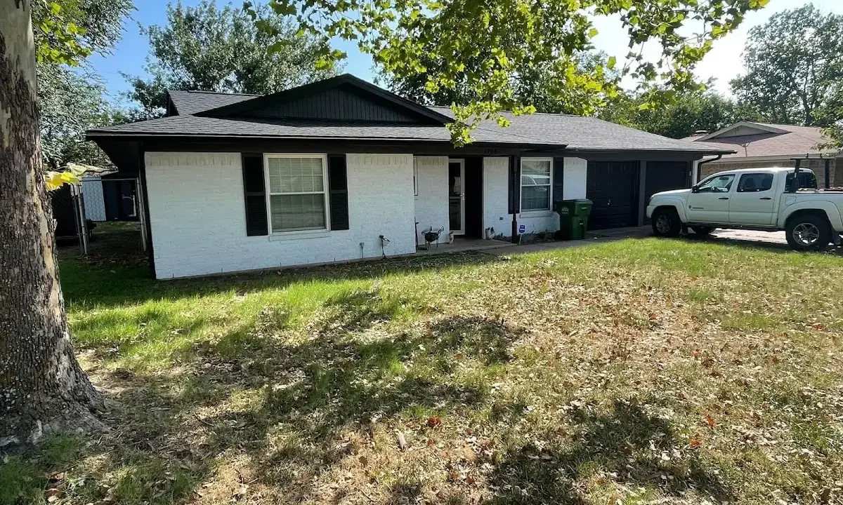 Professional roofing crew working on a residential roof in Sacramento